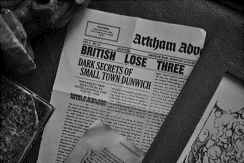 Close-up photo of the newspaper clipping from the Arkham Advertiser with a headline reading &lsquo;Dark secrets of small town Dunwich&rsquo;