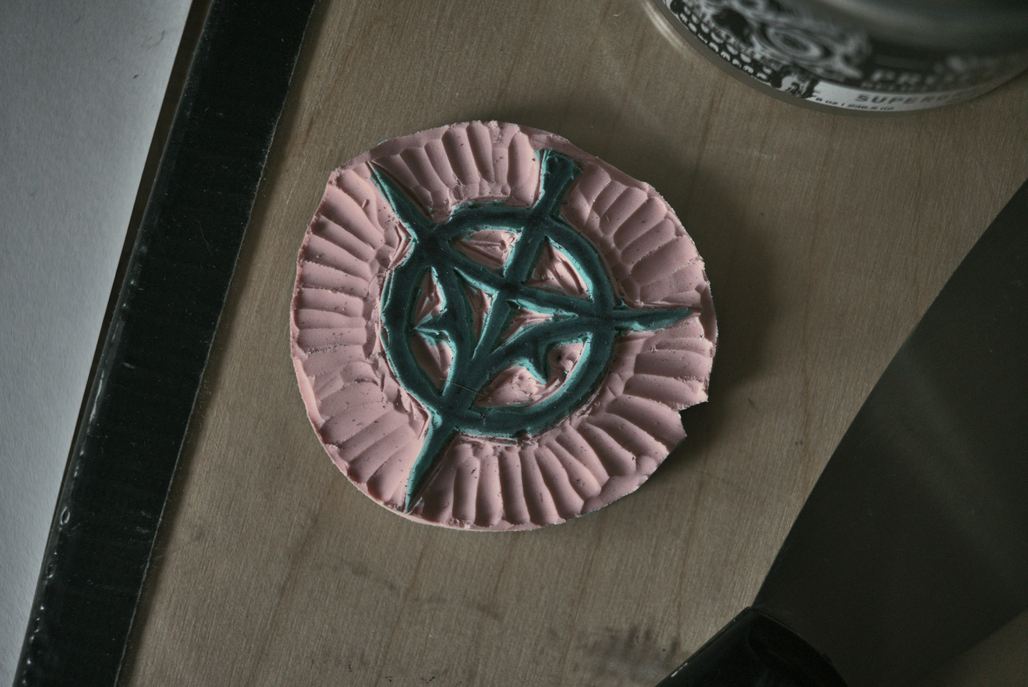 carved linocut symbol