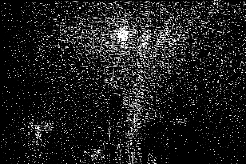 Red brick alleyway at night, filled with smoke