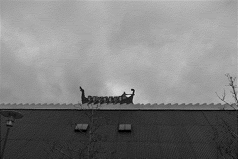 A drakkar detail on a roof with a wave pattern