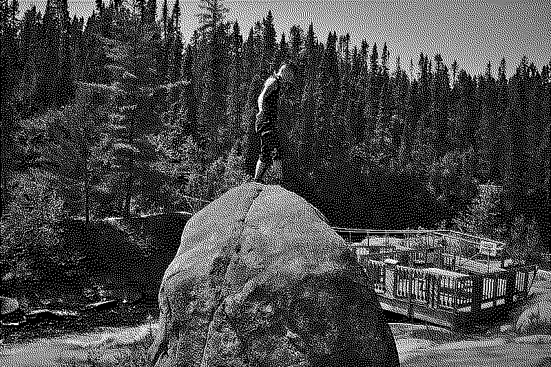Jess standing on a boulder