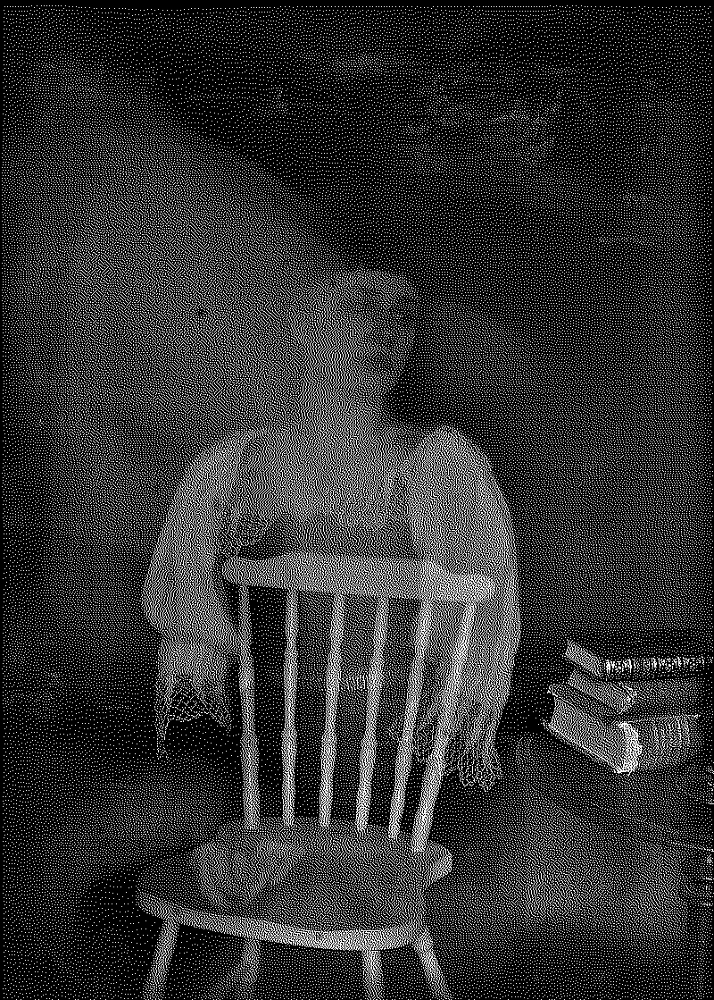 Ghostly Kita sitting on a chair